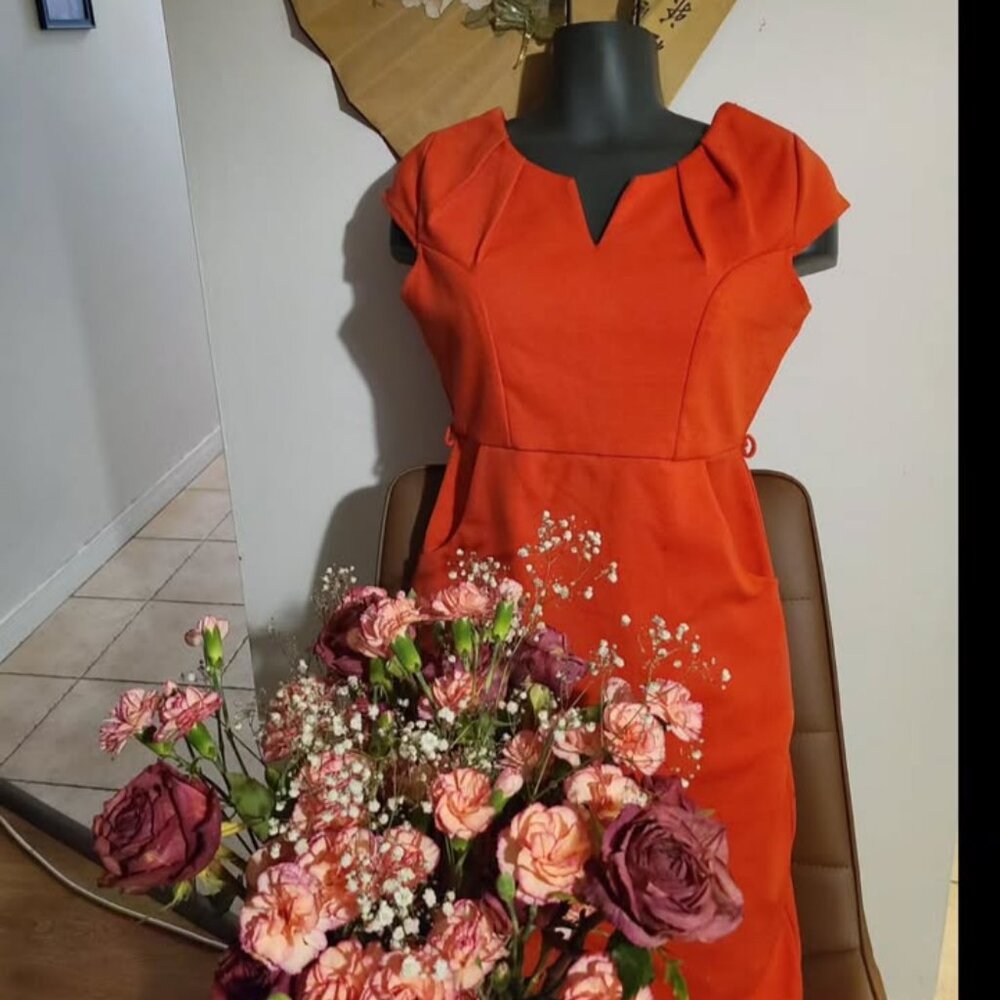 Pretty coral body con dress.